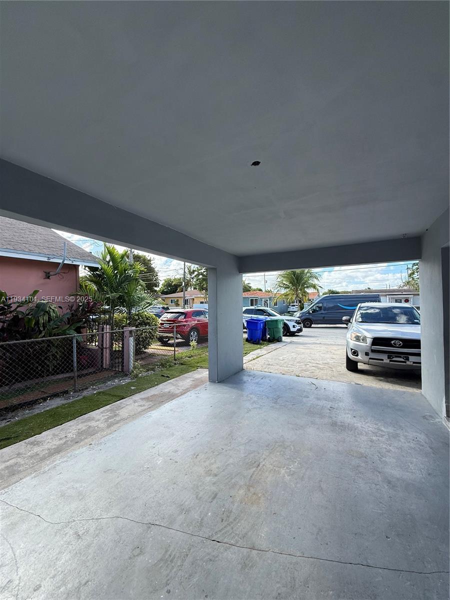 1055 Northwest 34th Avenue, Unit 1055 Miami, FL 33125 - Photo 4 of 19 a view of car parking