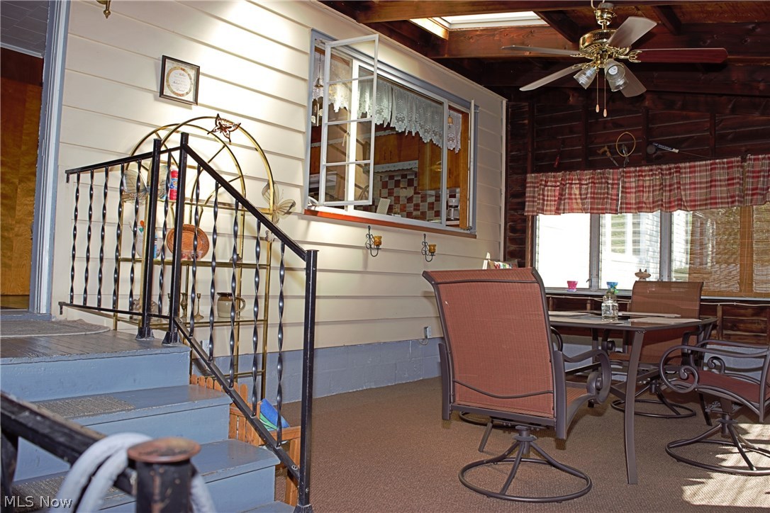 1128 Brownville Road Rome, OH 44085 - Photo 4 of 34 Enclosed porch/sunroom for enjoying nature without all the bugs.