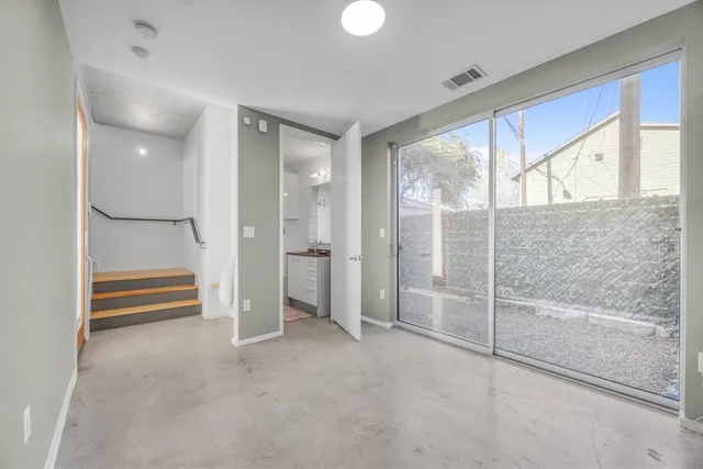 a bathroom with a granite countertop sink a toilet and bathtub