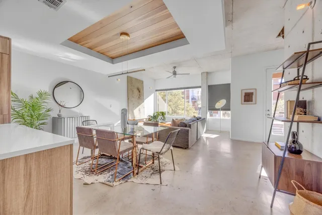 a kitchen with kitchen island a sink stainless steel appliances a counter top space and cabinets