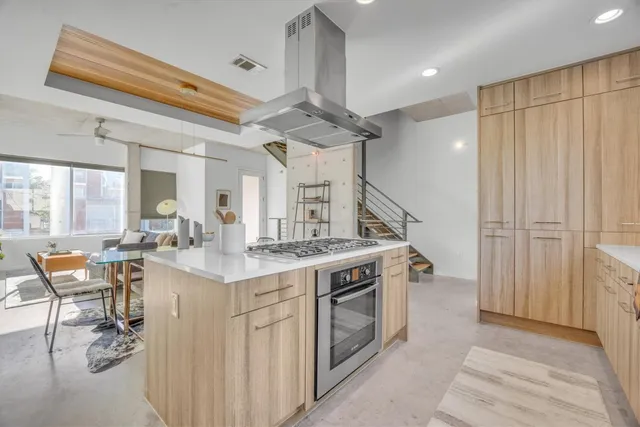 a view of living room with granite countertop furniture and fireplace