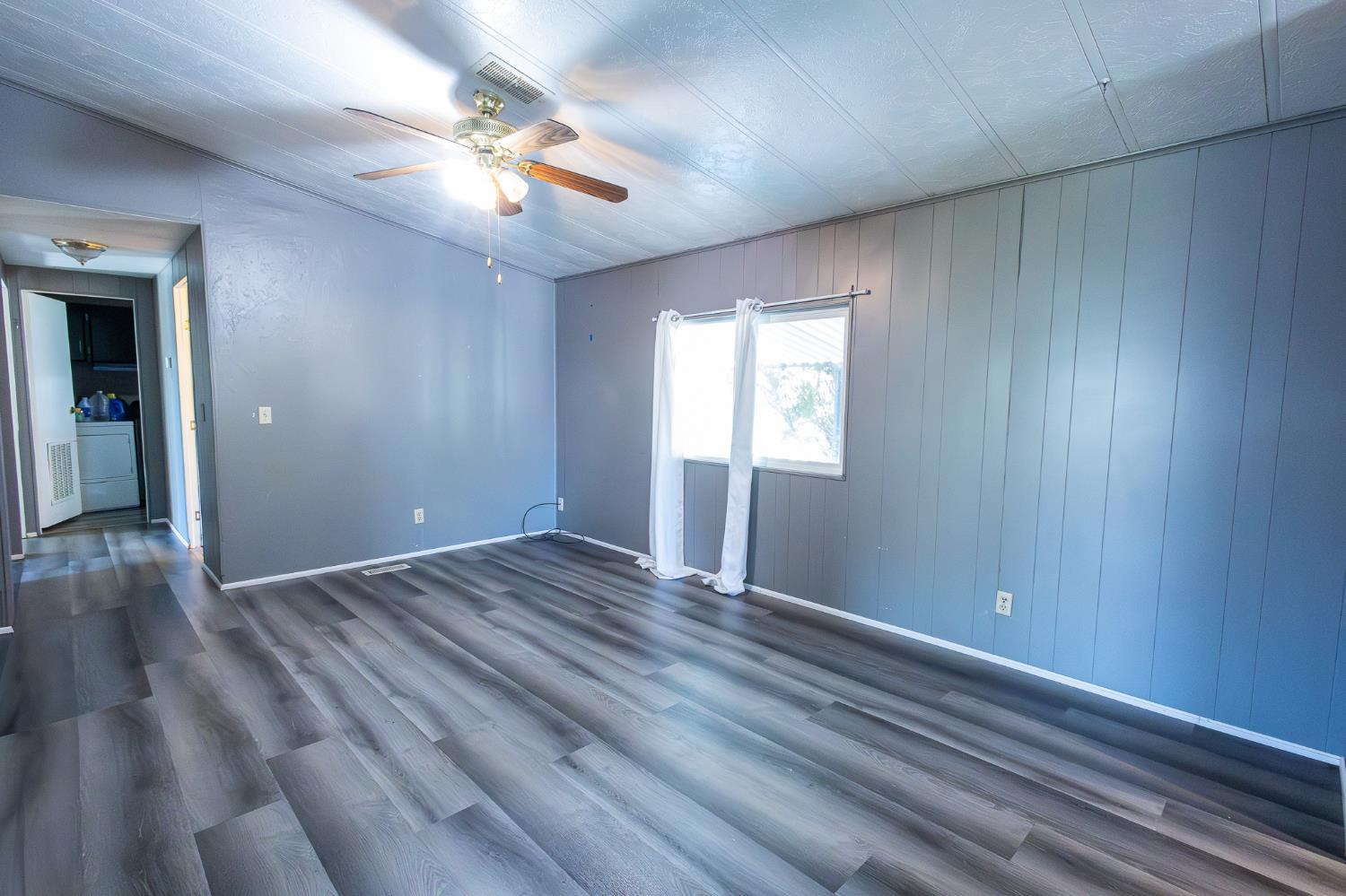 3950 Mack Road, Unit 129 Sacramento, CA 95823 - Photo 11 of 35 wooden floor in an empty room with a window