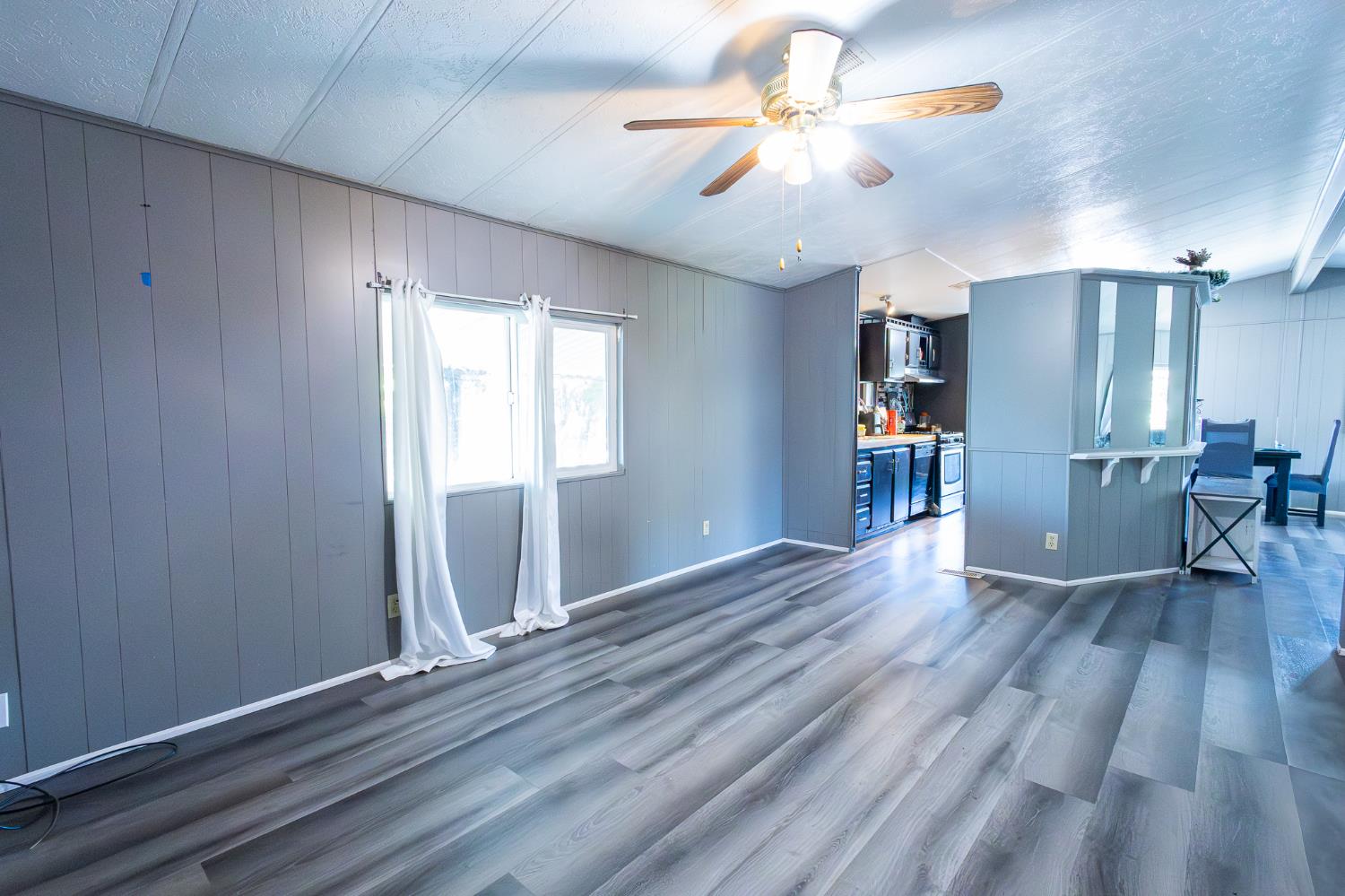 3950 Mack Road, Unit 129 Sacramento, CA 95823 - Photo 13 of 35 wooden floor in an empty room with a window