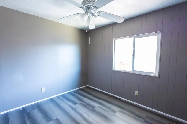 a view of room with window and ceiling fan