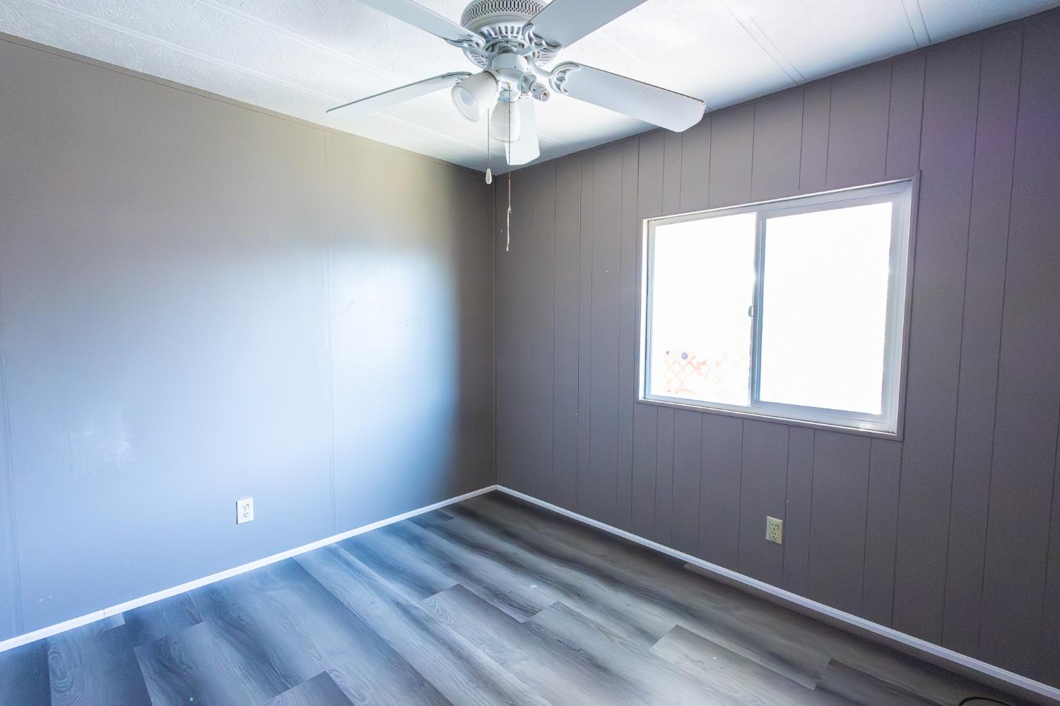 3950 Mack Road, Unit 129 Sacramento, CA 95823 - Photo 14 of 35 a view of room with window and ceiling fan