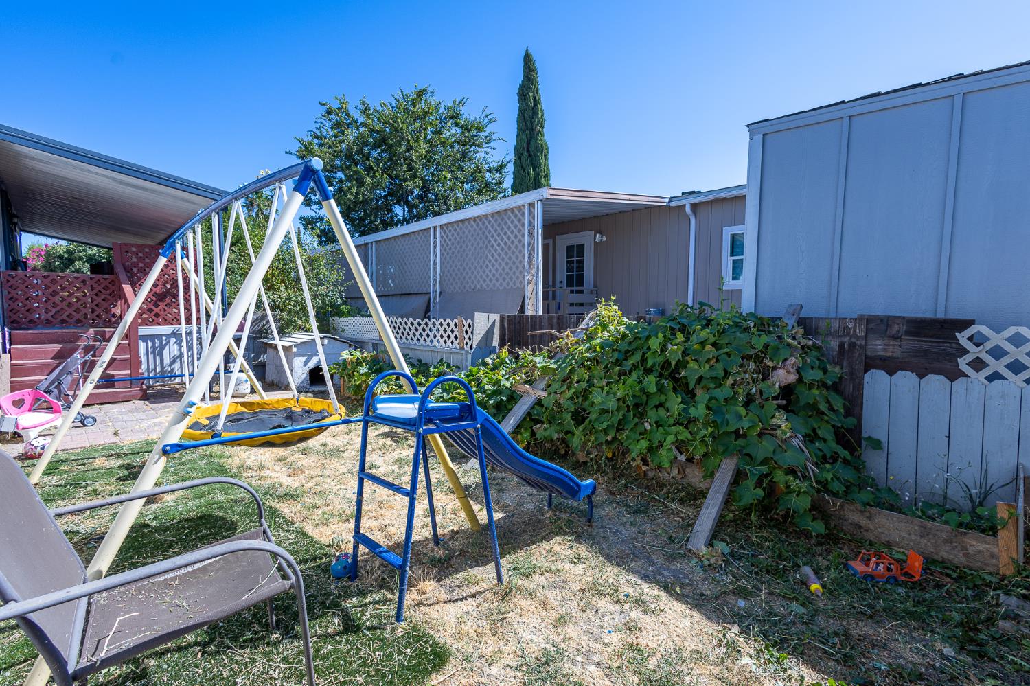 3950 Mack Road, Unit 129 Sacramento, CA 95823 - Photo 27 of 35 a view of a backyard with a patio