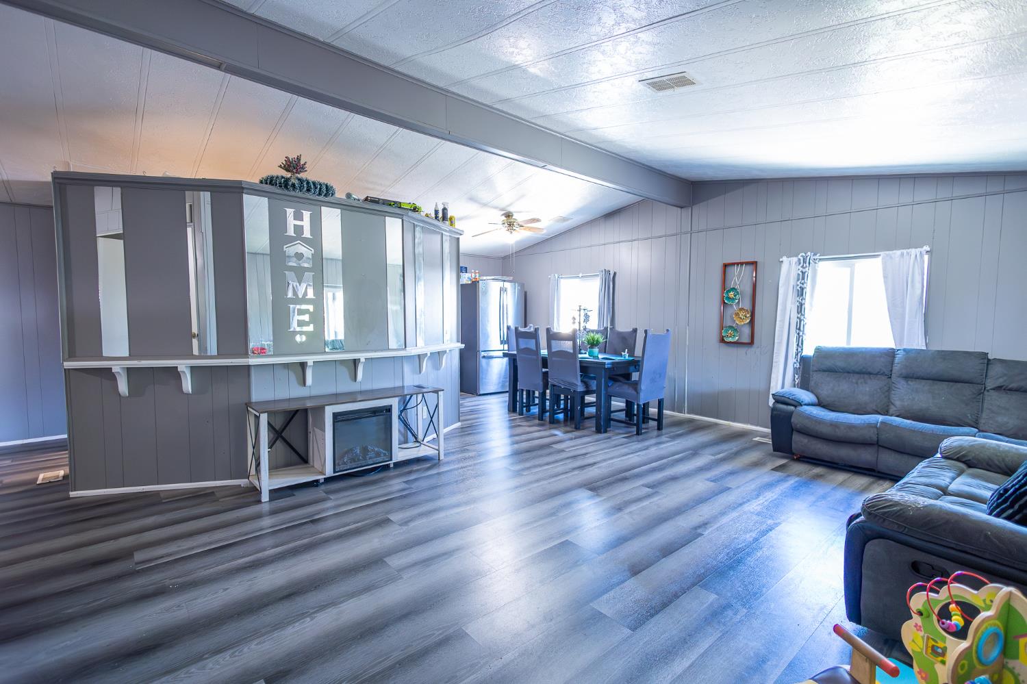 3950 Mack Road, Unit 129 Sacramento, CA 95823 - Photo 4 of 35 a living room with furniture and wooden floor