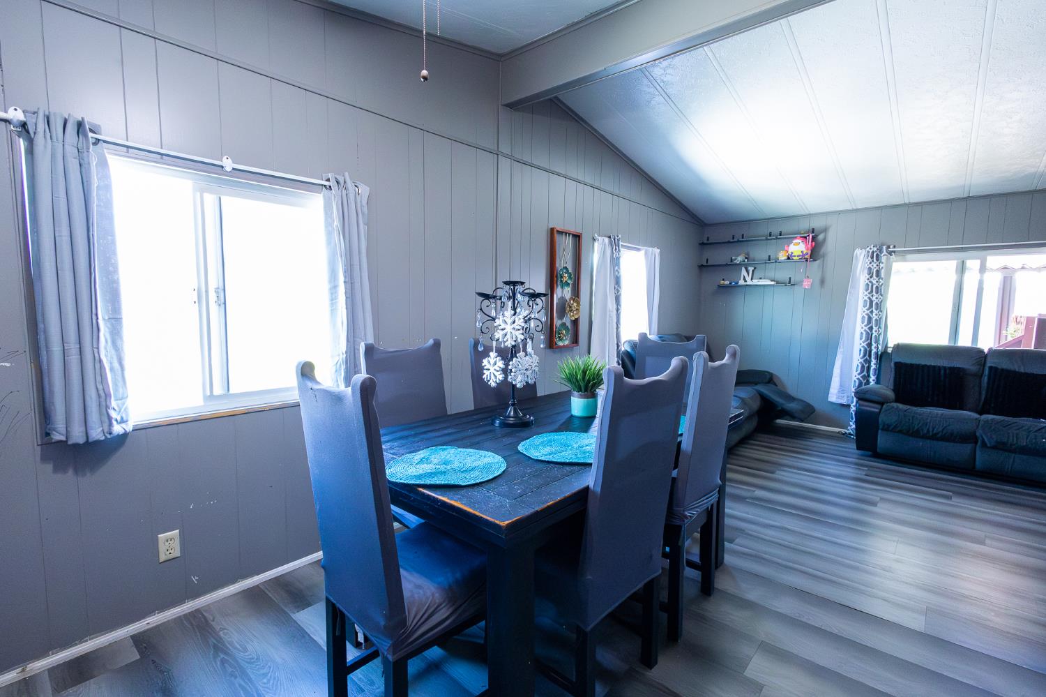 3950 Mack Road, Unit 129 Sacramento, CA 95823 - Photo 10 of 35 a view of a dining room with furniture window and wooden floor