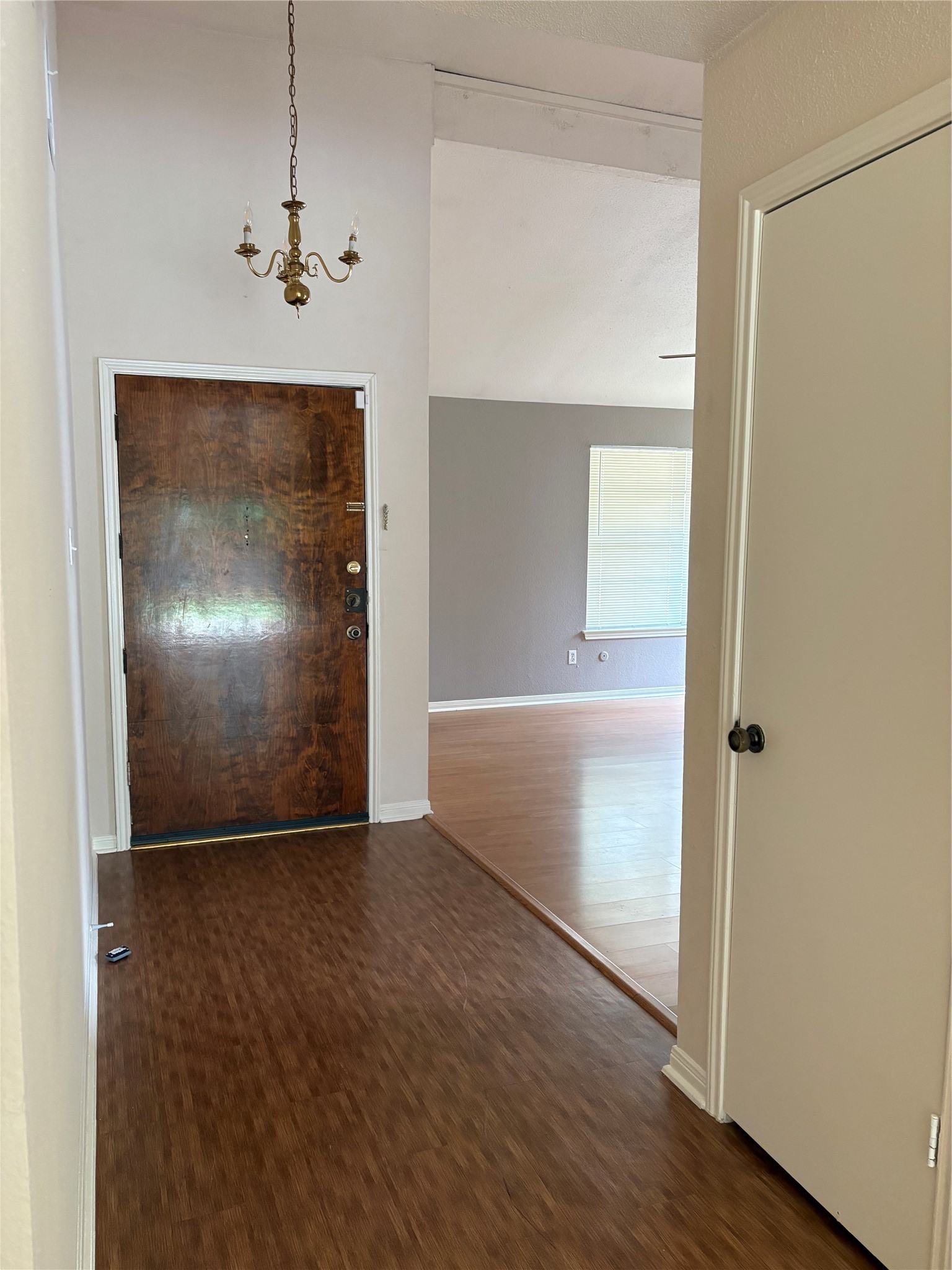 9111 Woodhouse Drive Spring, TX 77379 - Photo 5 of 7 an empty room with wooden floor mirror and windows