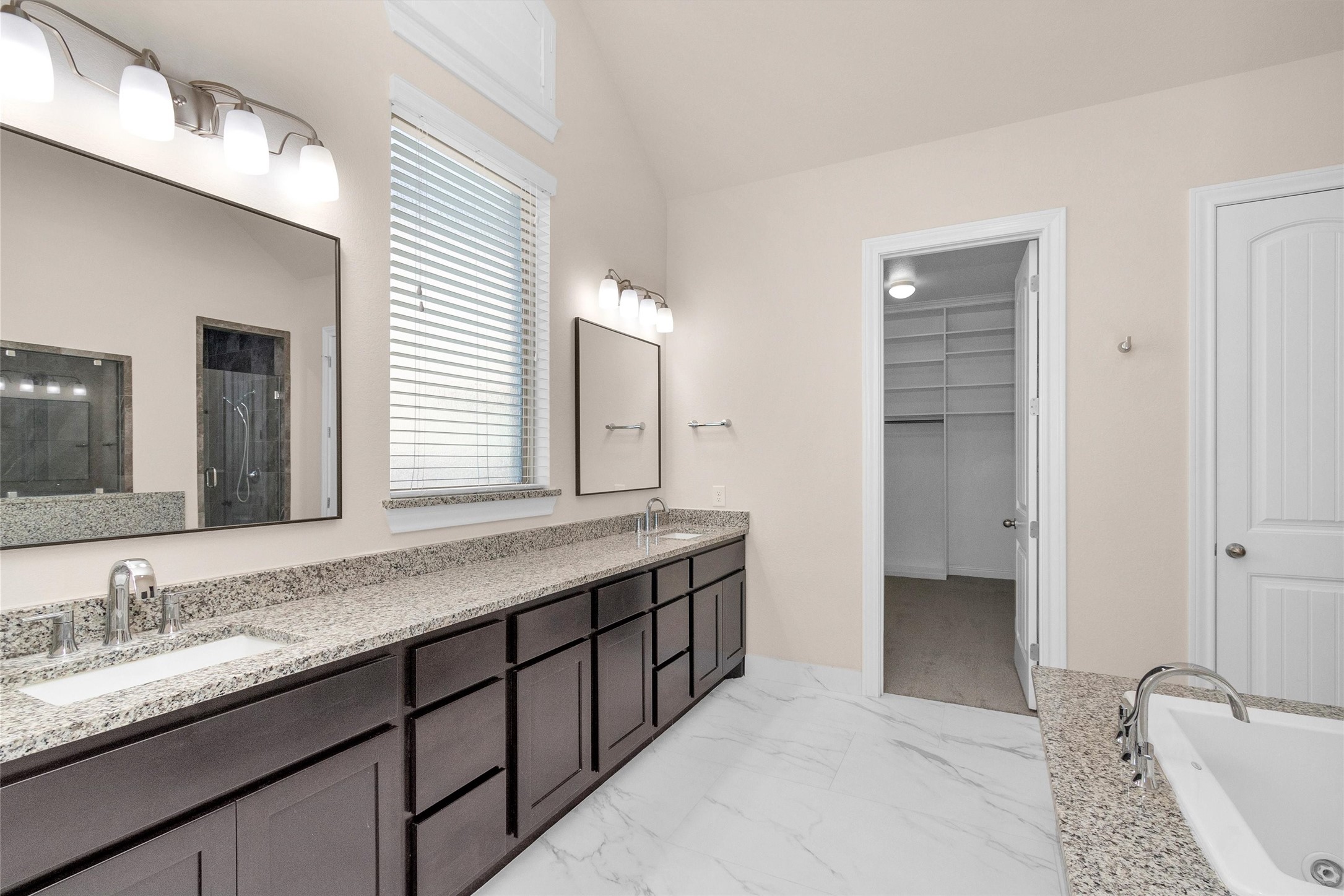 20707 Stillhaven Road Spring, TX 77379 - Photo 26 of 50 a bathroom with a granite countertop sink and a mirror