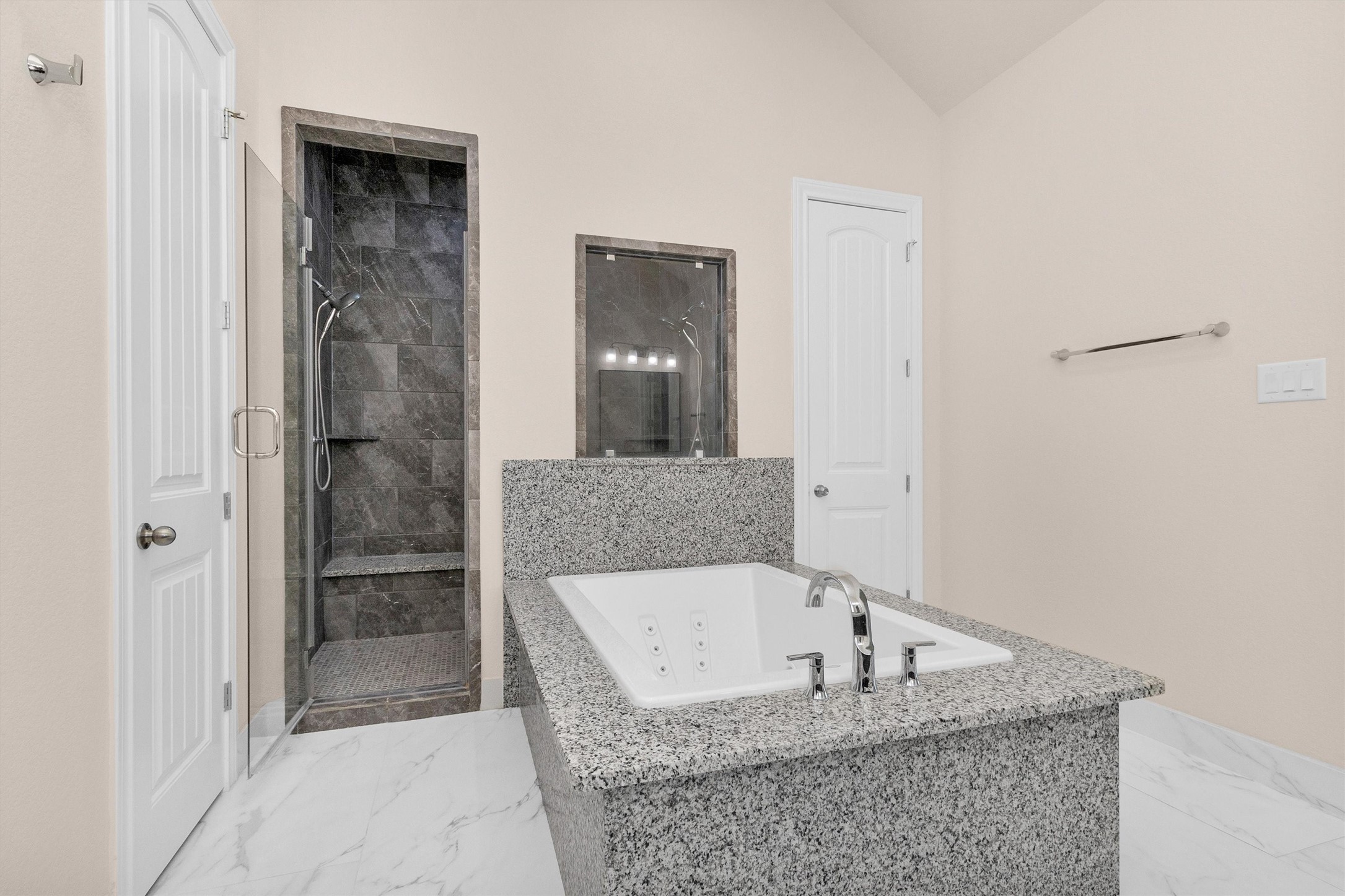 20707 Stillhaven Road Spring, TX 77379 - Photo 27 of 50 a bathroom with a granite countertop bathtub shower and mirror