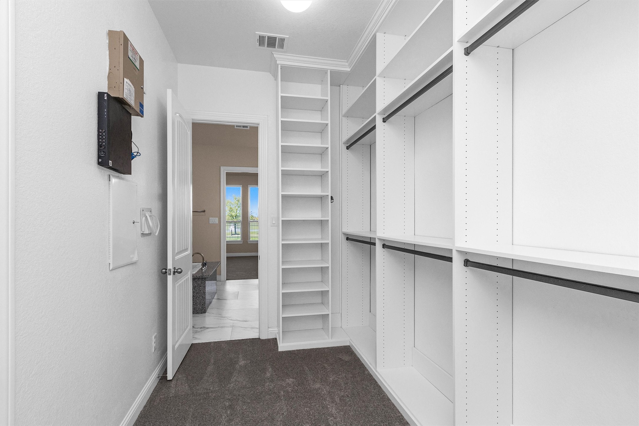 20707 Stillhaven Road Spring, TX 77379 - Photo 29 of 50 a view of walk in closet with empty racks