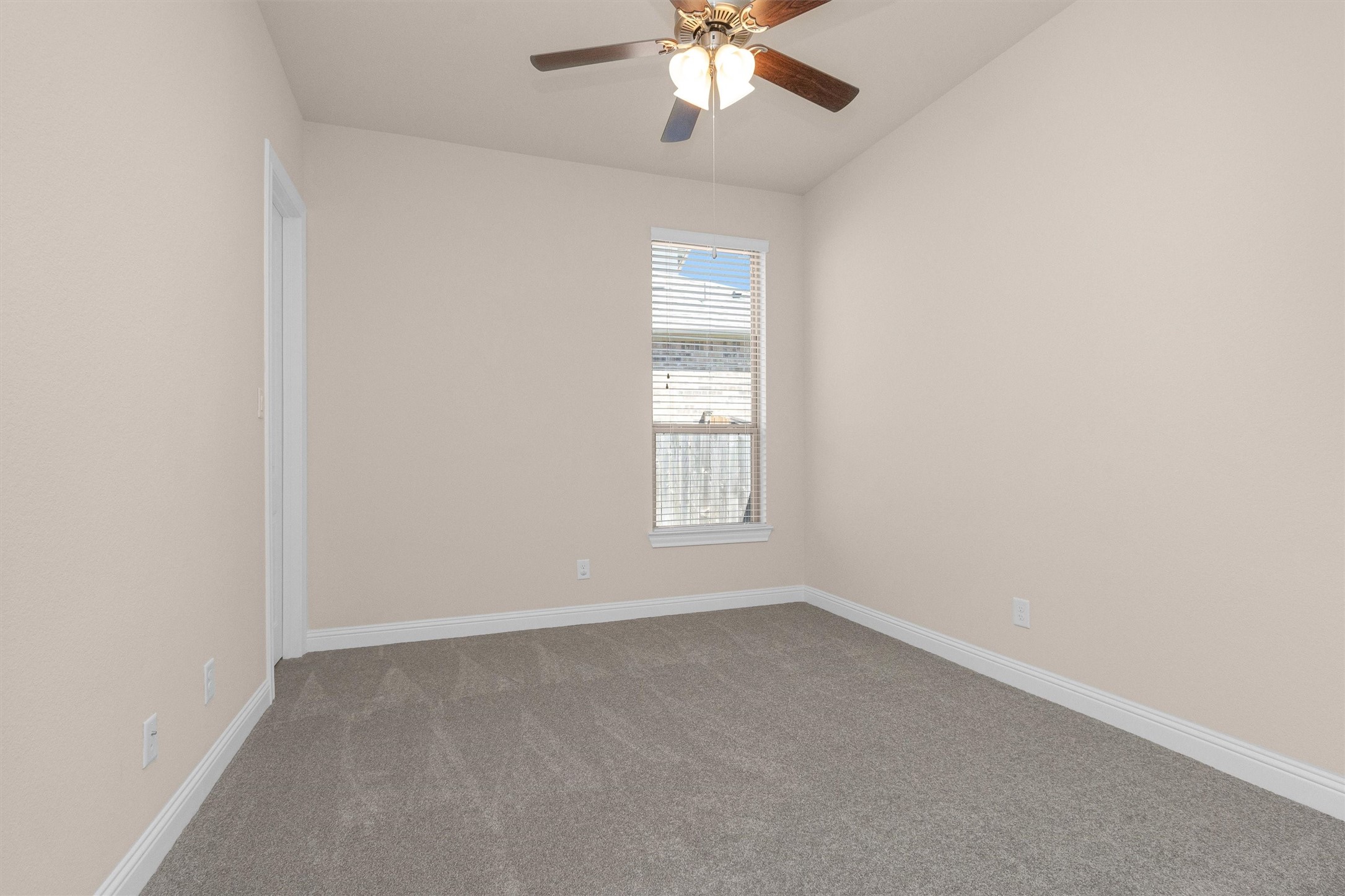 20707 Stillhaven Road Spring, TX 77379 - Photo 35 of 50 an empty room with windows and fan