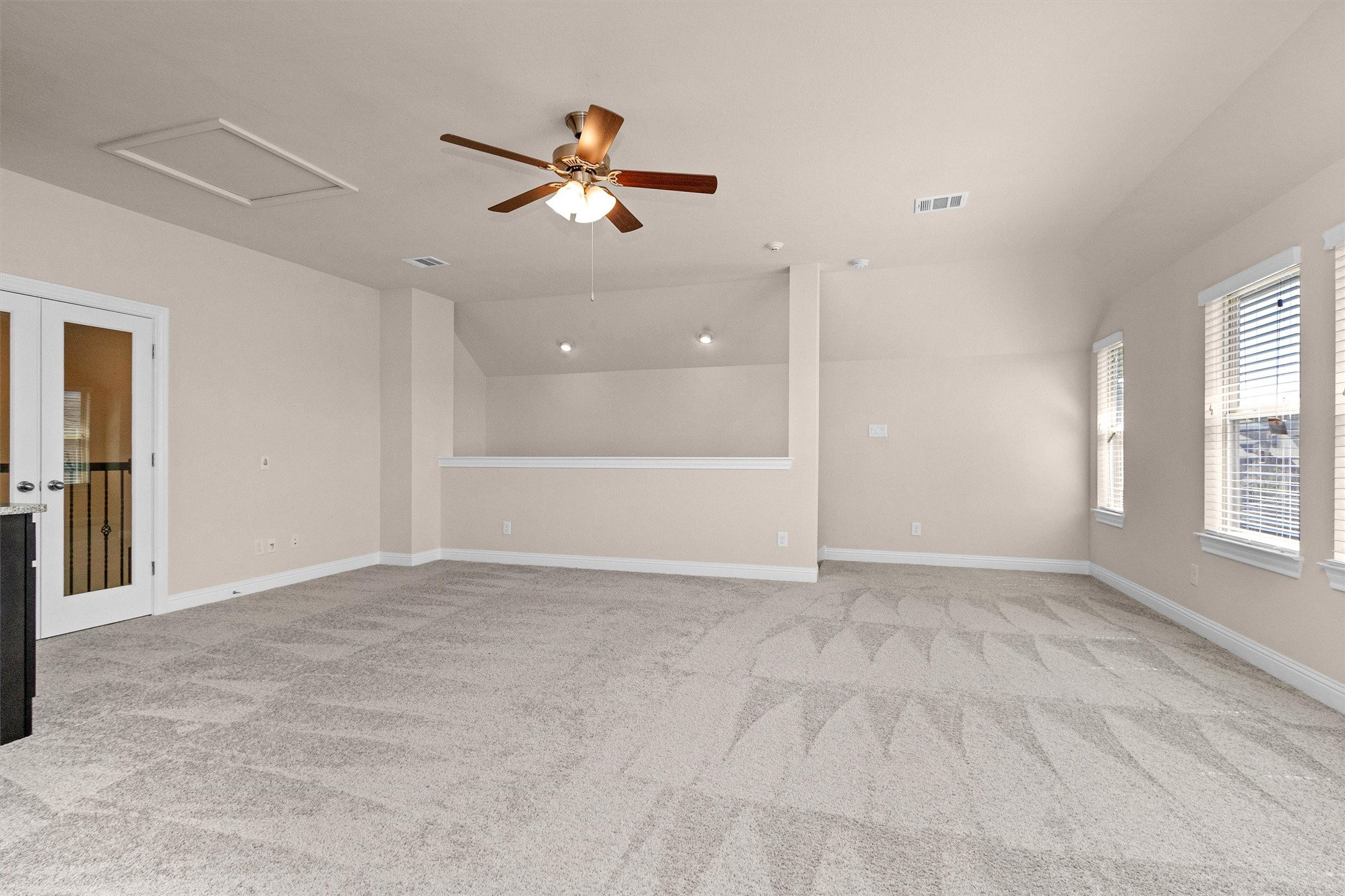 20707 Stillhaven Road Spring, TX 77379 - Photo 37 of 50 an empty room with windows and fan