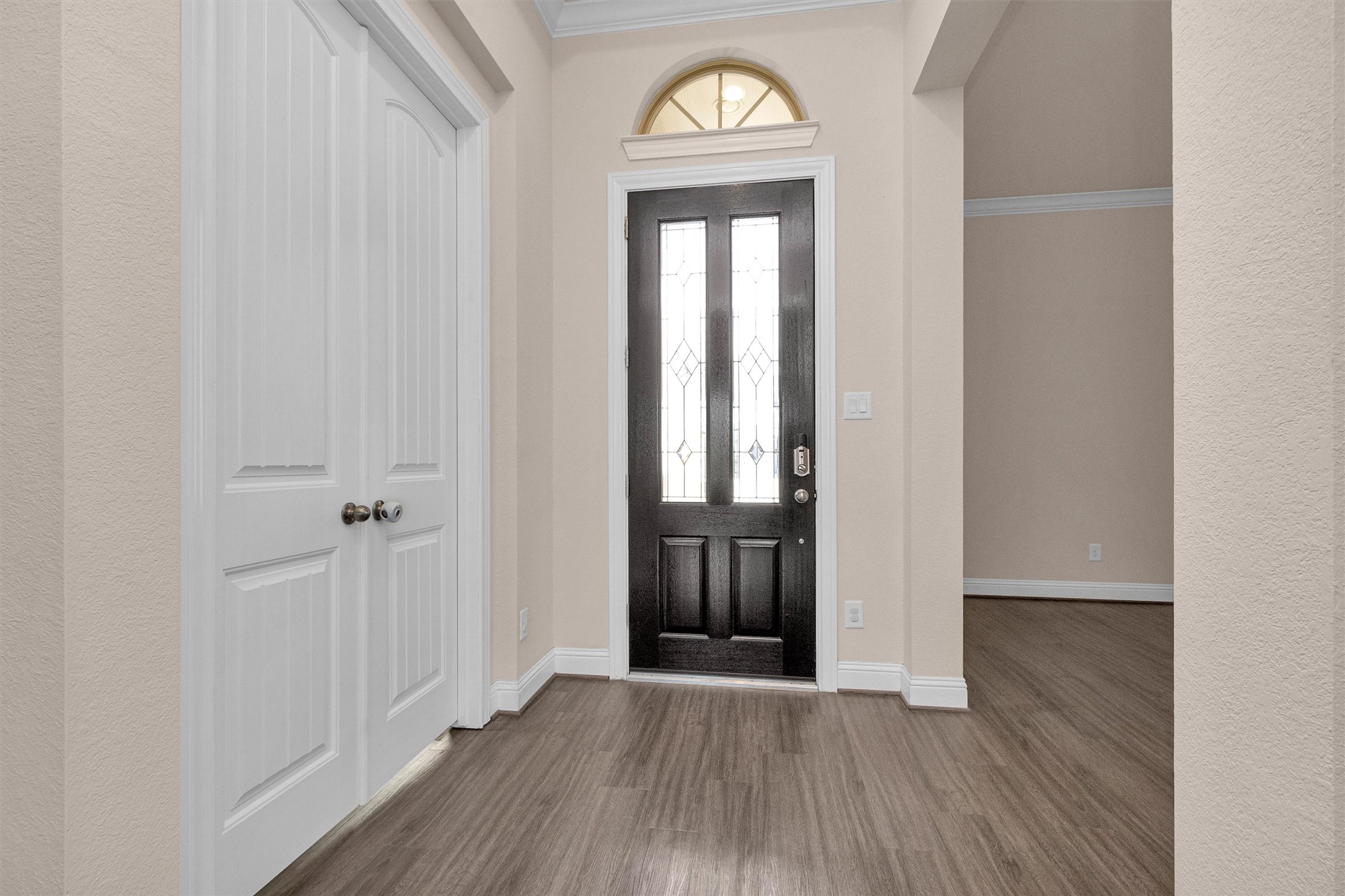 20707 Stillhaven Road Spring, TX 77379 - Photo 6 of 50 an empty room with wooden floor and a window