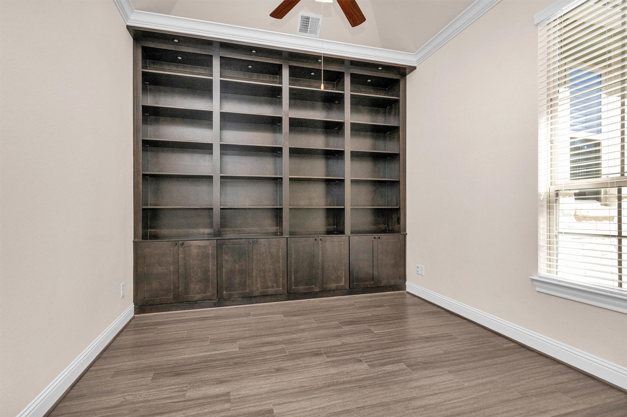 20707 Stillhaven Road Spring, TX 77379 - Photo 8 of 50 a view of a room with wooden floor and shelf