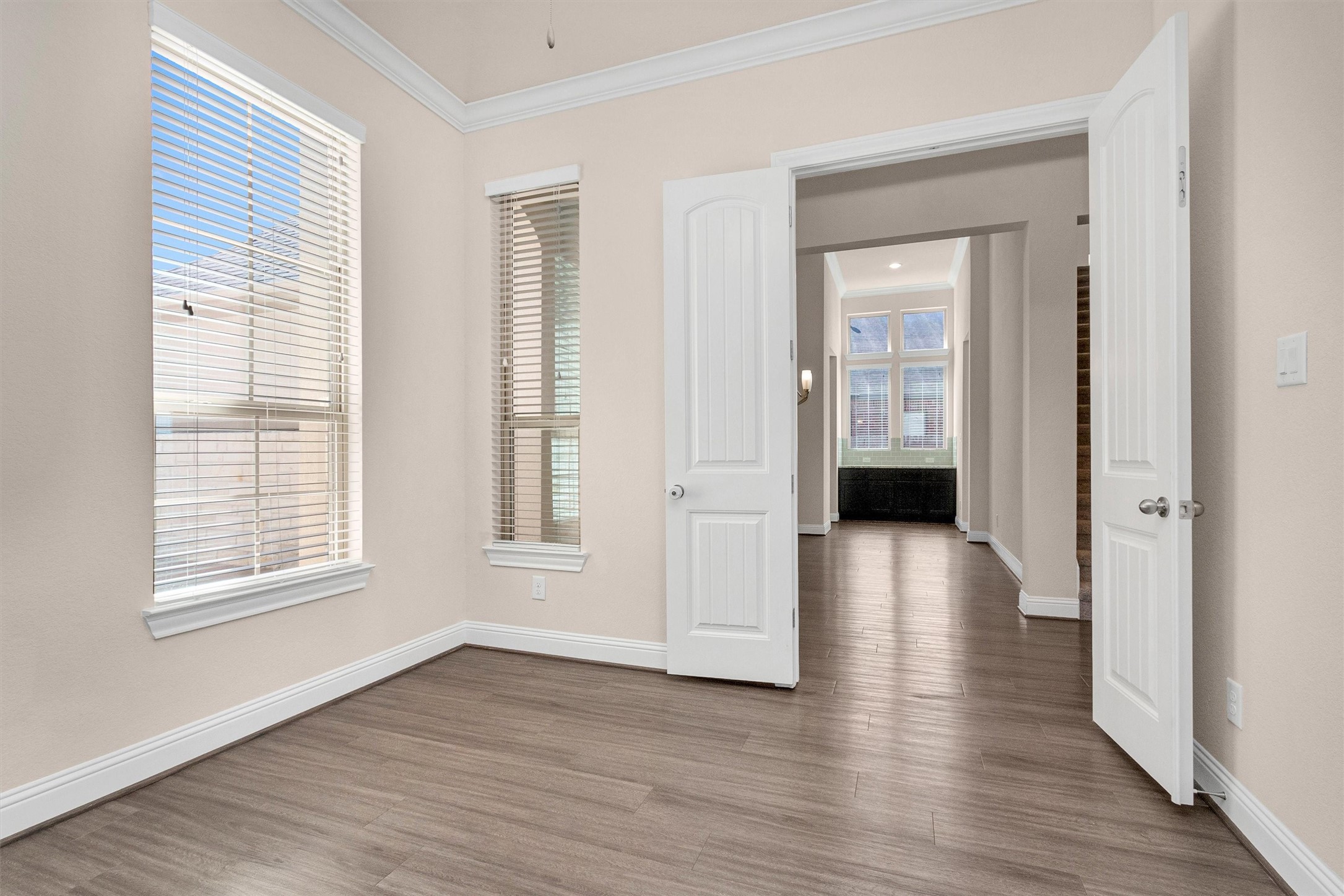 20707 Stillhaven Road Spring, TX 77379 - Photo 9 of 50 an empty room with wooden floor and windows