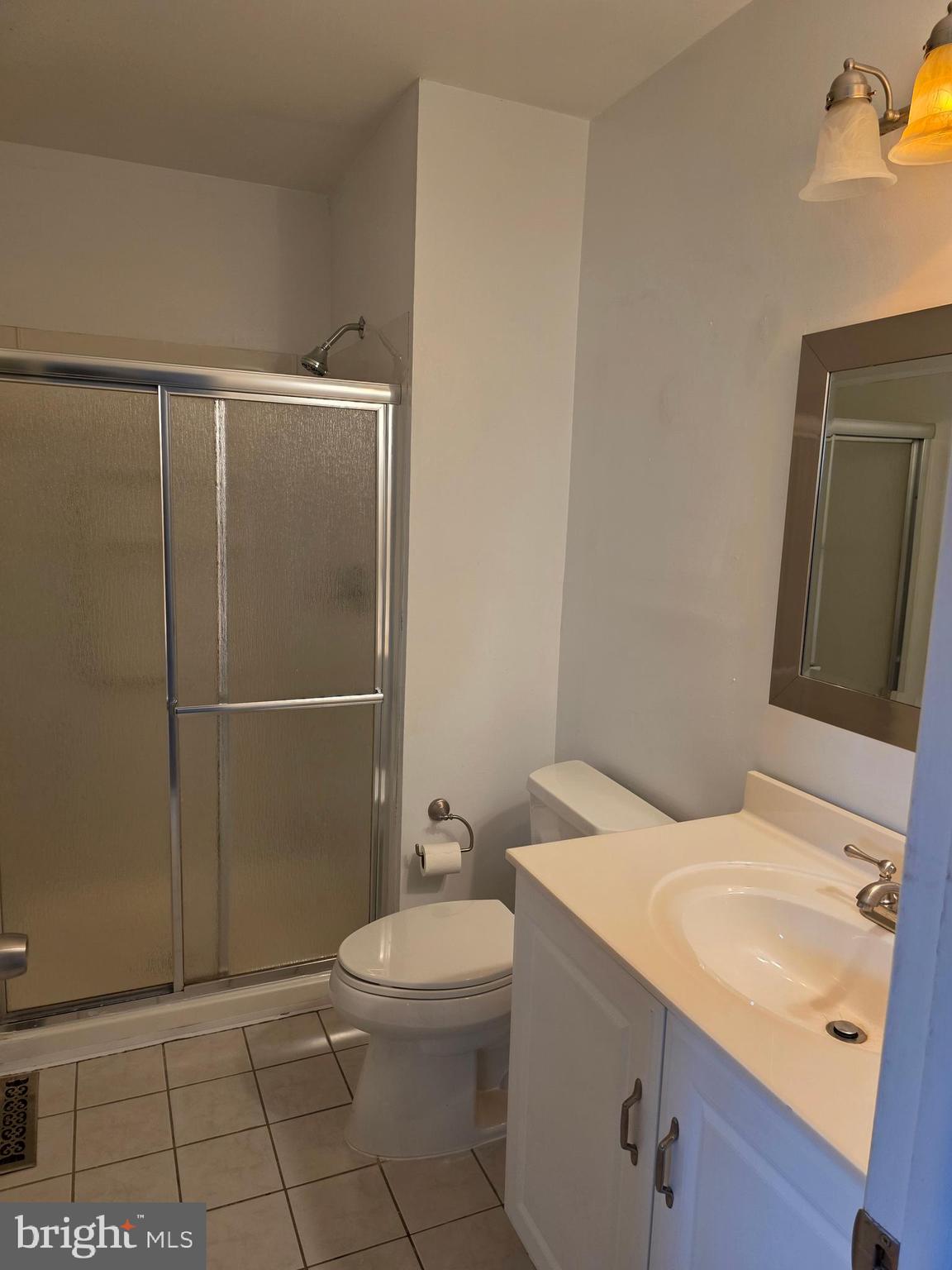 9 Georgetown Road Lindenwold, NJ 08021 - Photo 9 of 14 a bathroom with a sink a toilet and shower