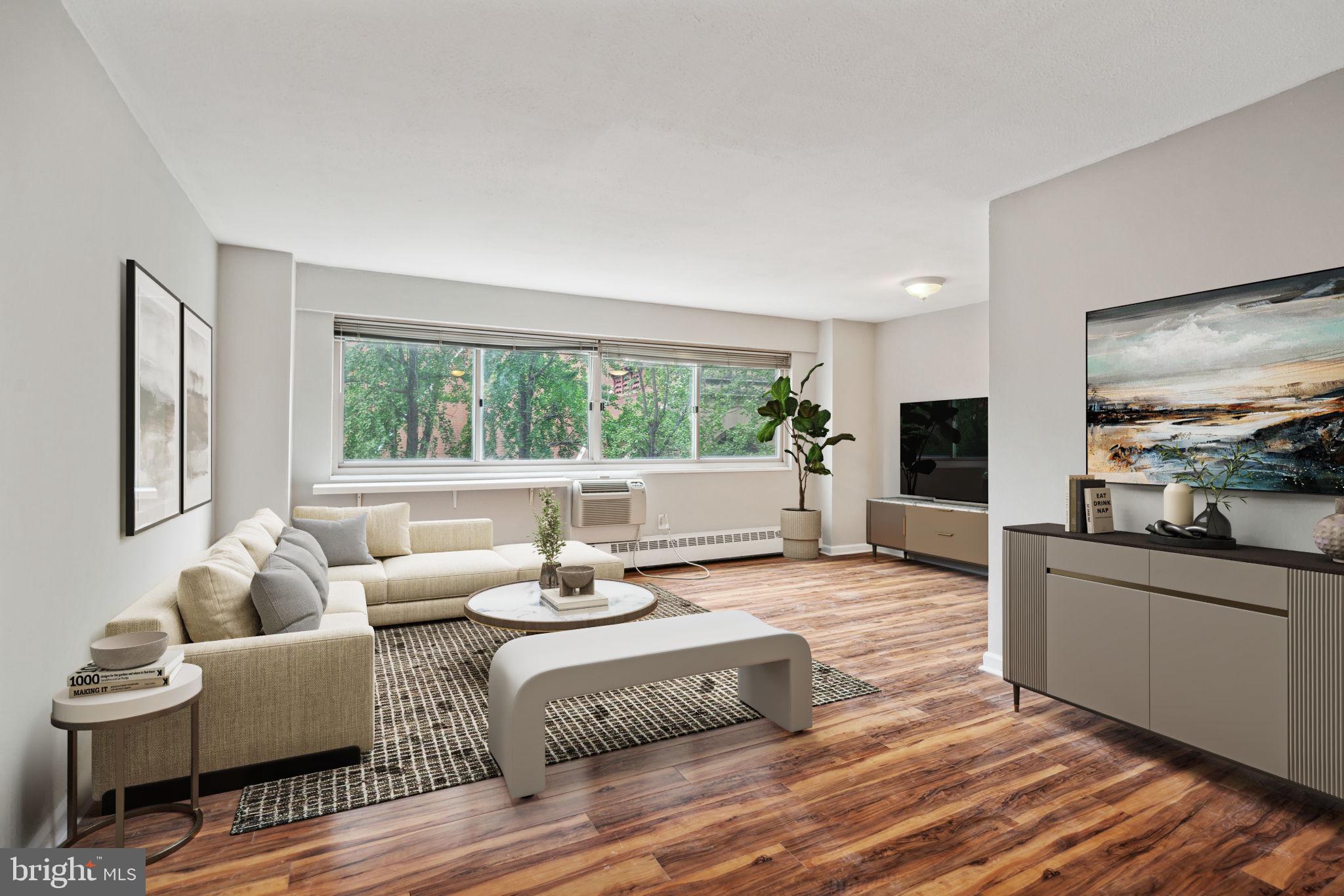 2101 Chestnut Street, Unit 415A Philadelphia, PA 19103 - Photo 1 of 20 a living room with furniture and a large window