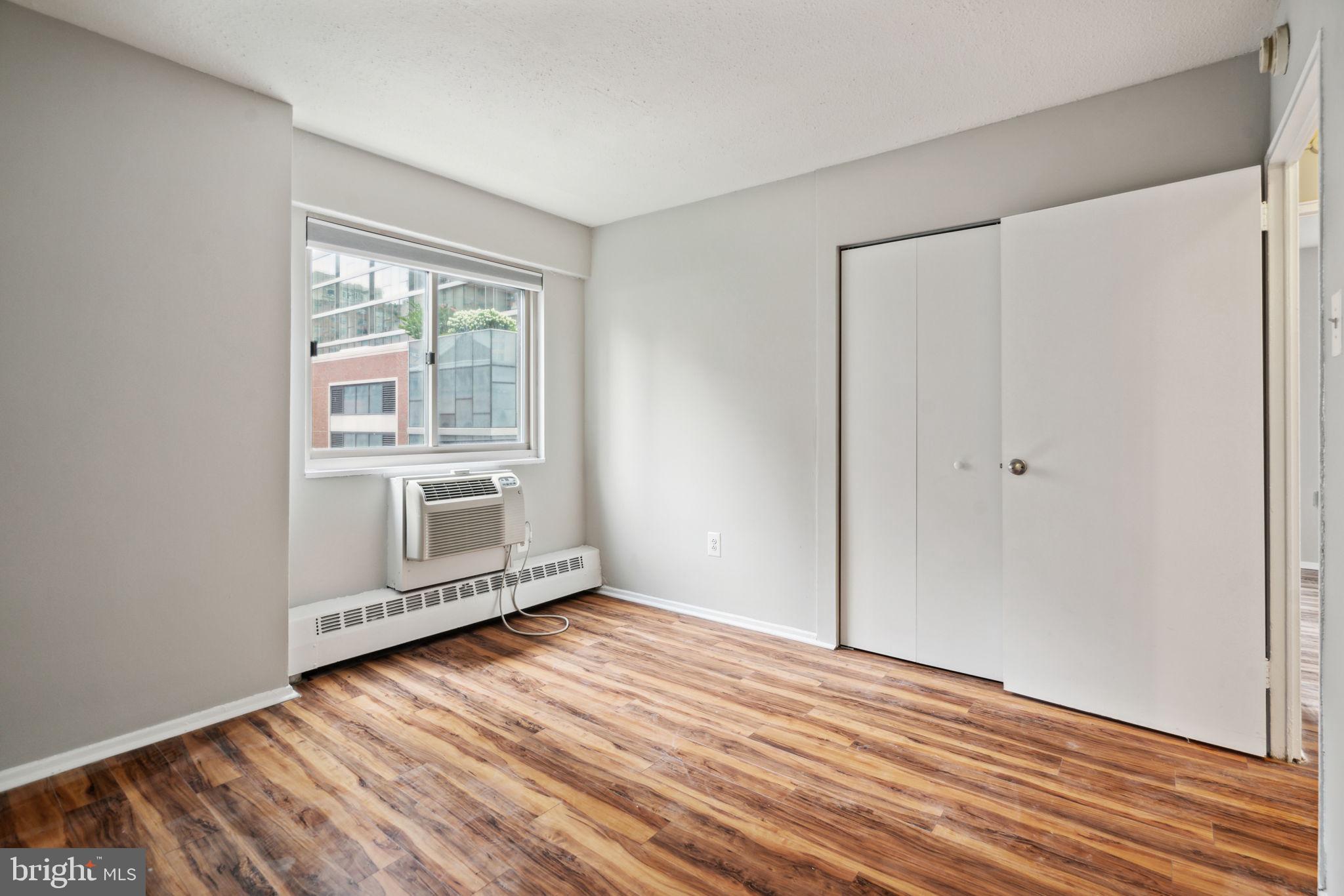 2101 Chestnut Street, Unit 415A Philadelphia, PA 19103 - Photo 11 of 20 a view of wooden floor and windows in a room
