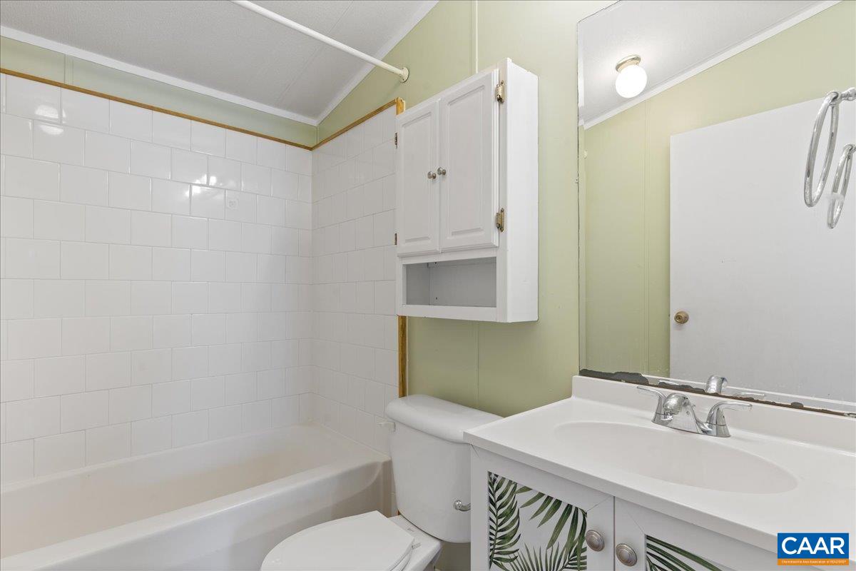 9319 3 Notch Road Louisa, VA 23093 - Photo 16 of 22 a bathroom with a sink toilet and shower