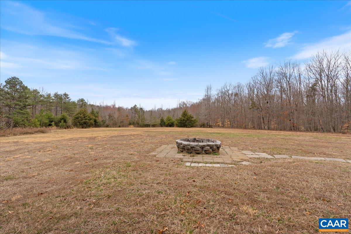 9319 3 Notch Road Louisa, VA 23093 - Photo 19 of 22 a view of outdoor space with green field and trees