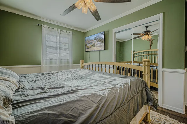 a bedroom with a bed and a window