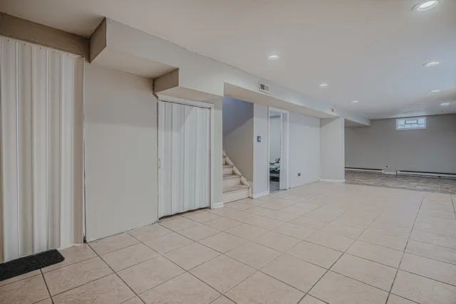a view of an empty room with a fireplace
