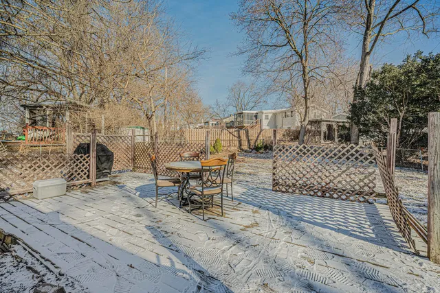 a house that has a tree in front of it