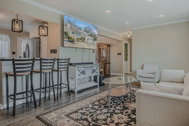 a living room with furniture and a rug