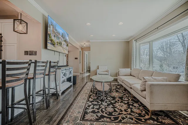 a living room with furniture and a rug