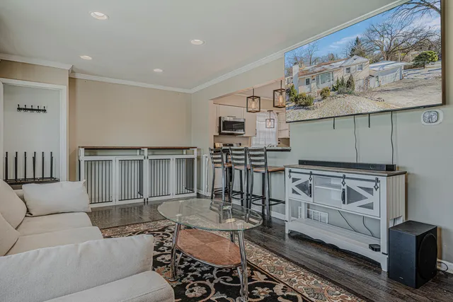 a kitchen with cabinets and chairs