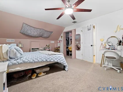 a bedroom with a bed and large cabinets
