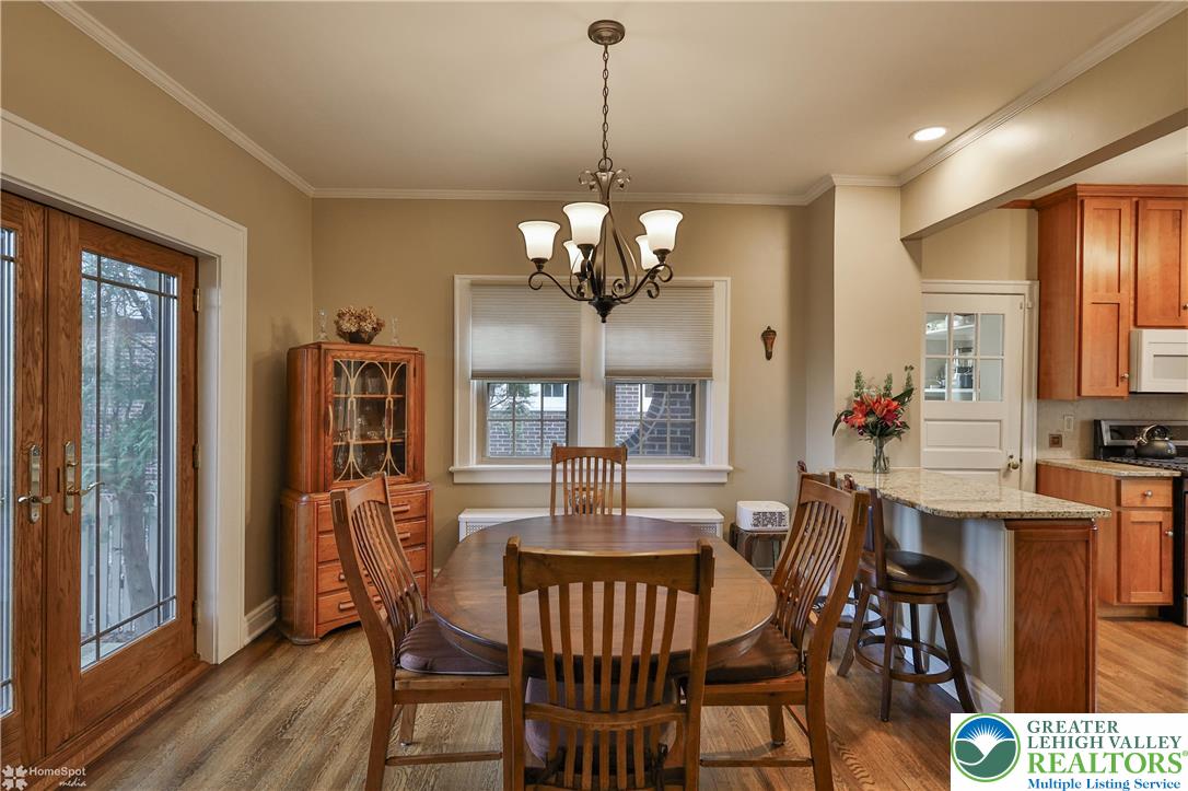 1808 Sycamore Street Bethlehem, PA 18017 - Photo 14 of 55 a view of a dining room with furniture a chandelier and wooden floor