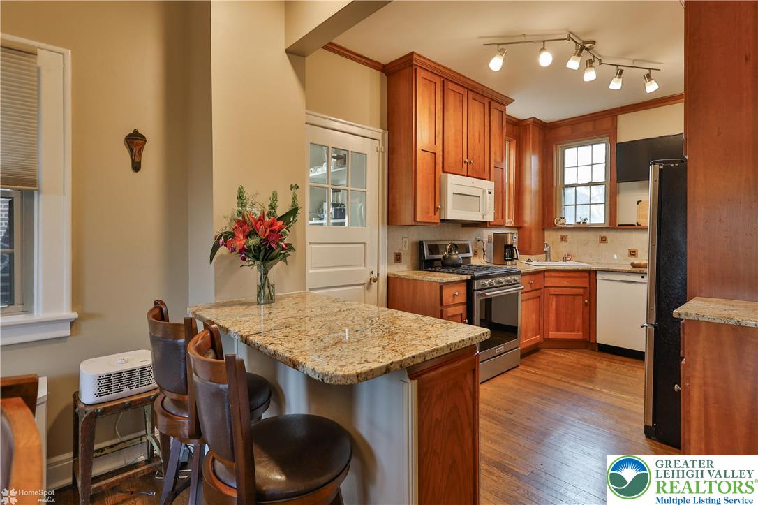 1808 Sycamore Street Bethlehem, PA 18017 - Photo 17 of 55 a kitchen with a table and chairs in it