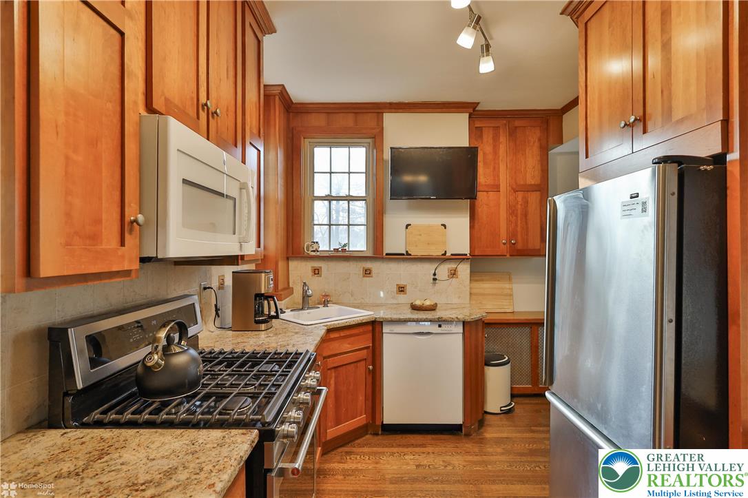 1808 Sycamore Street Bethlehem, PA 18017 - Photo 18 of 55 a kitchen with a sink a refrigerator and cabinets