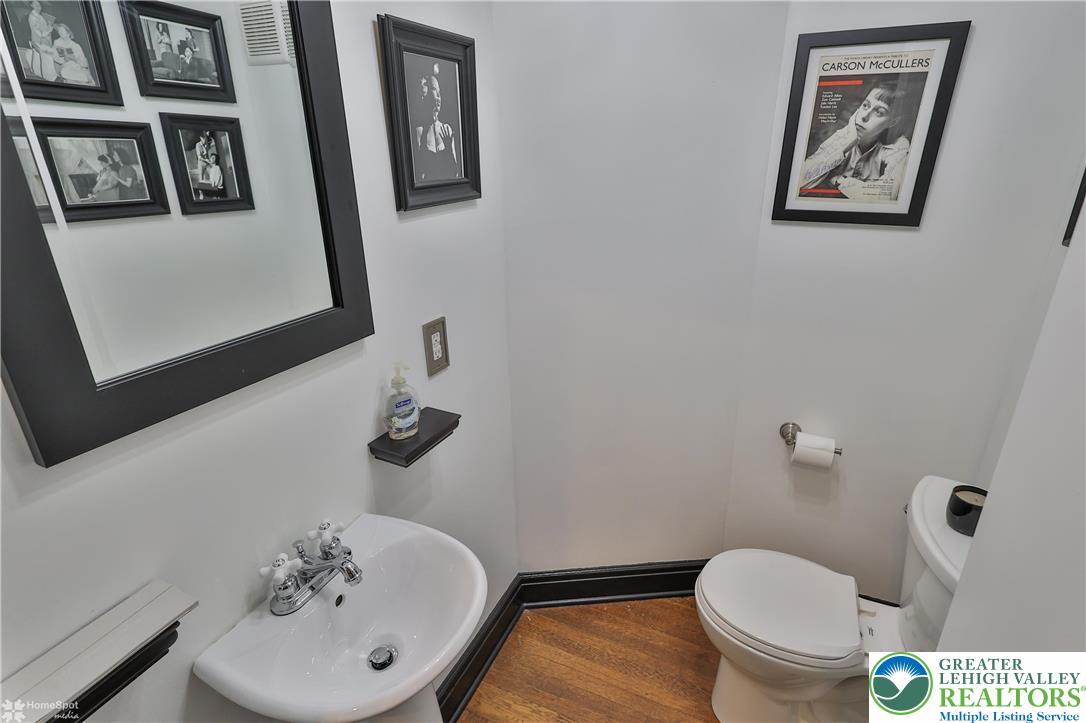 1808 Sycamore Street Bethlehem, PA 18017 - Photo 22 of 55 a bathroom with a toilet sink and mirror