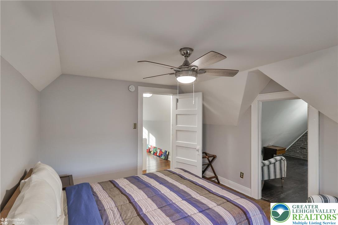 1808 Sycamore Street Bethlehem, PA 18017 - Photo 36 of 55 a bedroom with a bed and a chandelier