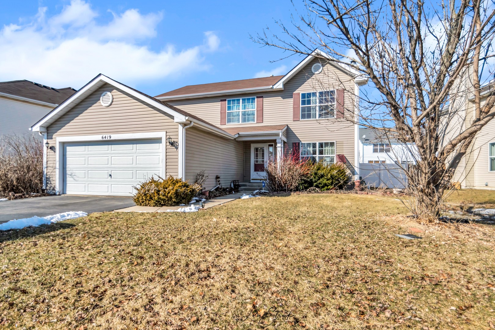 6419 Roth Drive Joliet, IL 60431 - Photo 1 of 13 a front view of a house with a yard