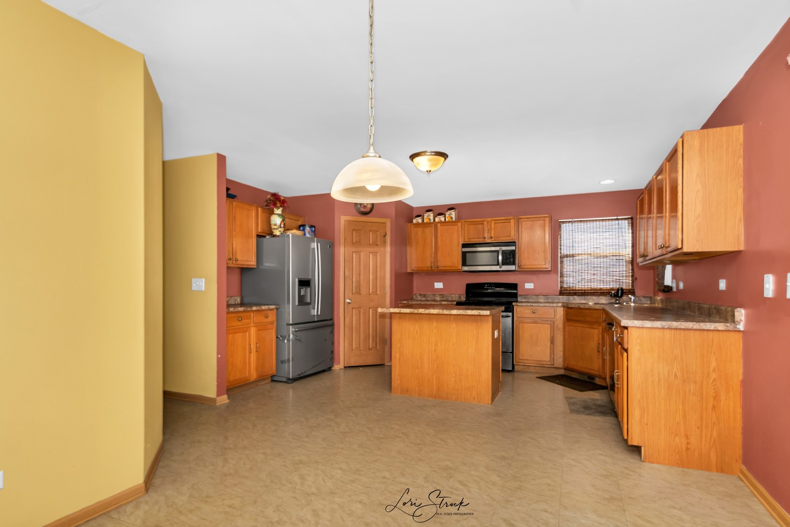 6419 Roth Drive Joliet, IL 60431 - Photo 8 of 13 a kitchen with stainless steel appliances granite countertop a sink a stove and refrigerator
