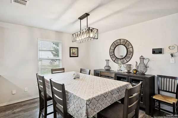 a kitchen with a sink appliances and cabinets