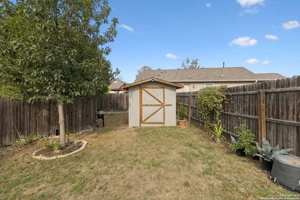 a view of a house with a yard and garage