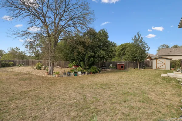 a view of a backyard of the house