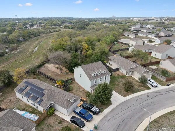 an aerial view of a house with a lake view