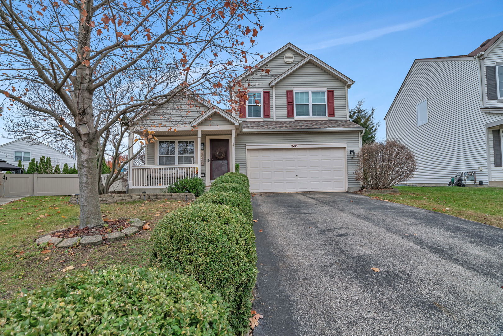1605 Heritage Pointe Court Plainfield, IL 60586 - Photo 1 of 21 a front view of a house with a yard and garage
