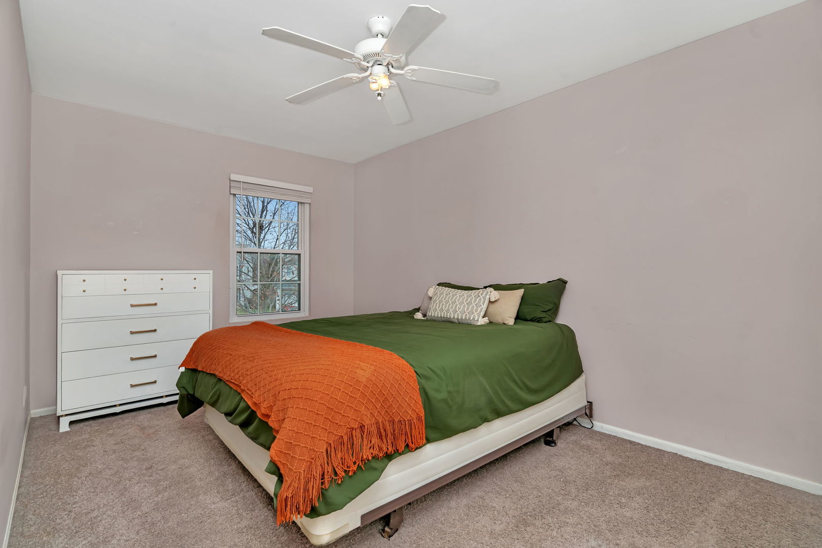 1605 Heritage Pointe Court Plainfield, IL 60586 - Photo 12 of 21 a bed sitting in a bedroom next to a window