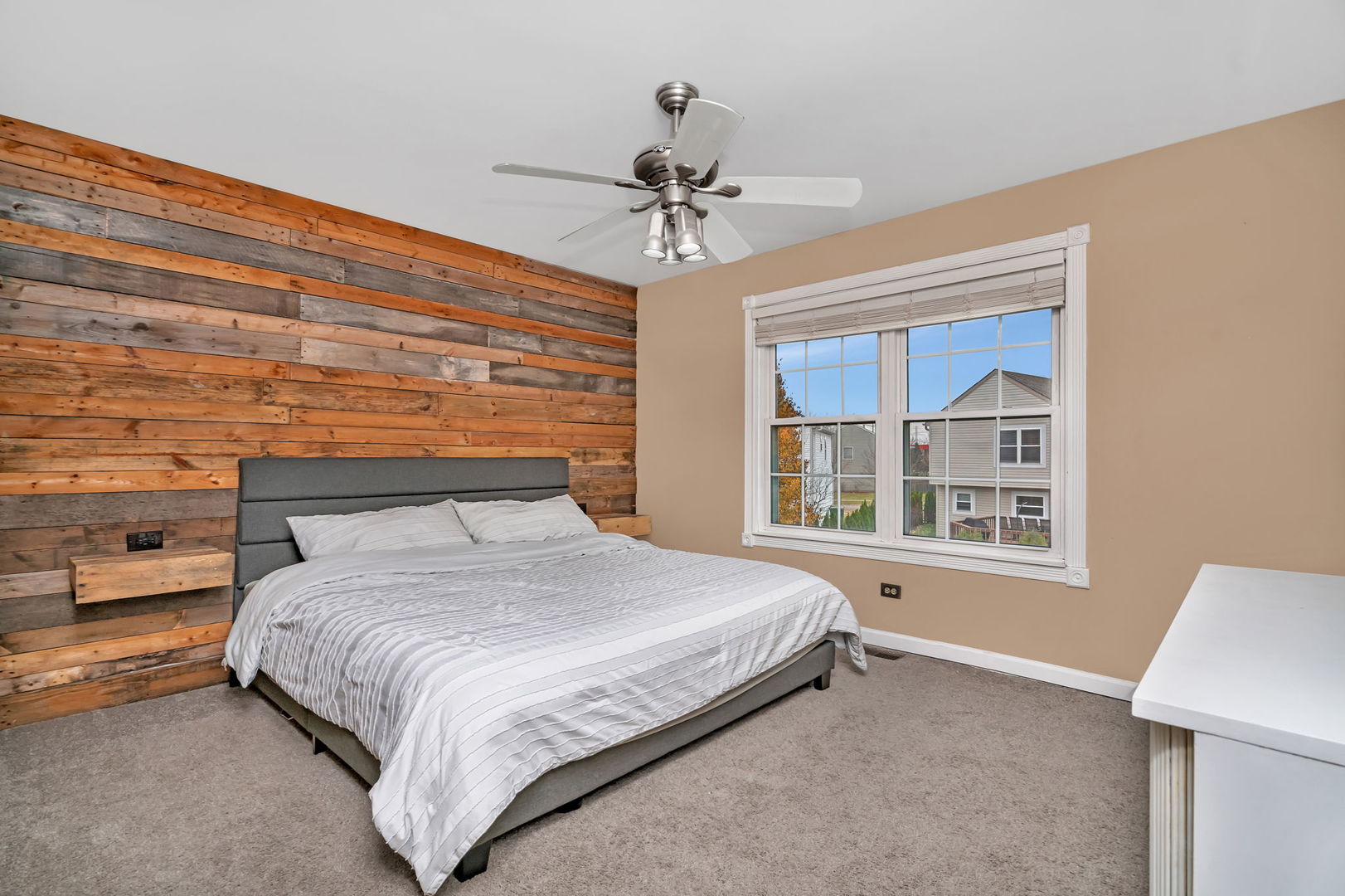 1605 Heritage Pointe Court Plainfield, IL 60586 - Photo 13 of 21 a bedroom with a bed and a chandelier