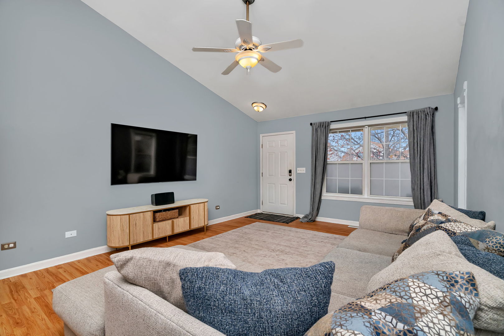 1605 Heritage Pointe Court Plainfield, IL 60586 - Photo 3 of 21 a bedroom with a large bed and a flat screen tv
