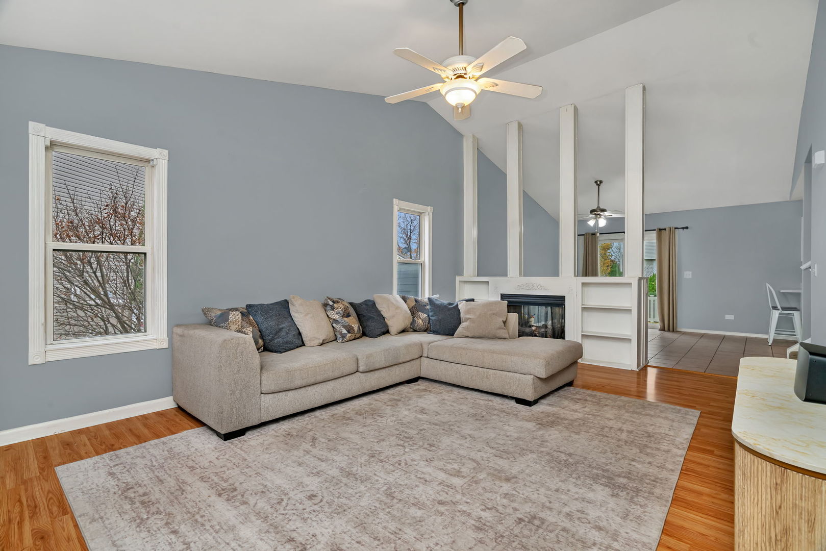 1605 Heritage Pointe Court Plainfield, IL 60586 - Photo 4 of 21 a living room with furniture and a chandelier