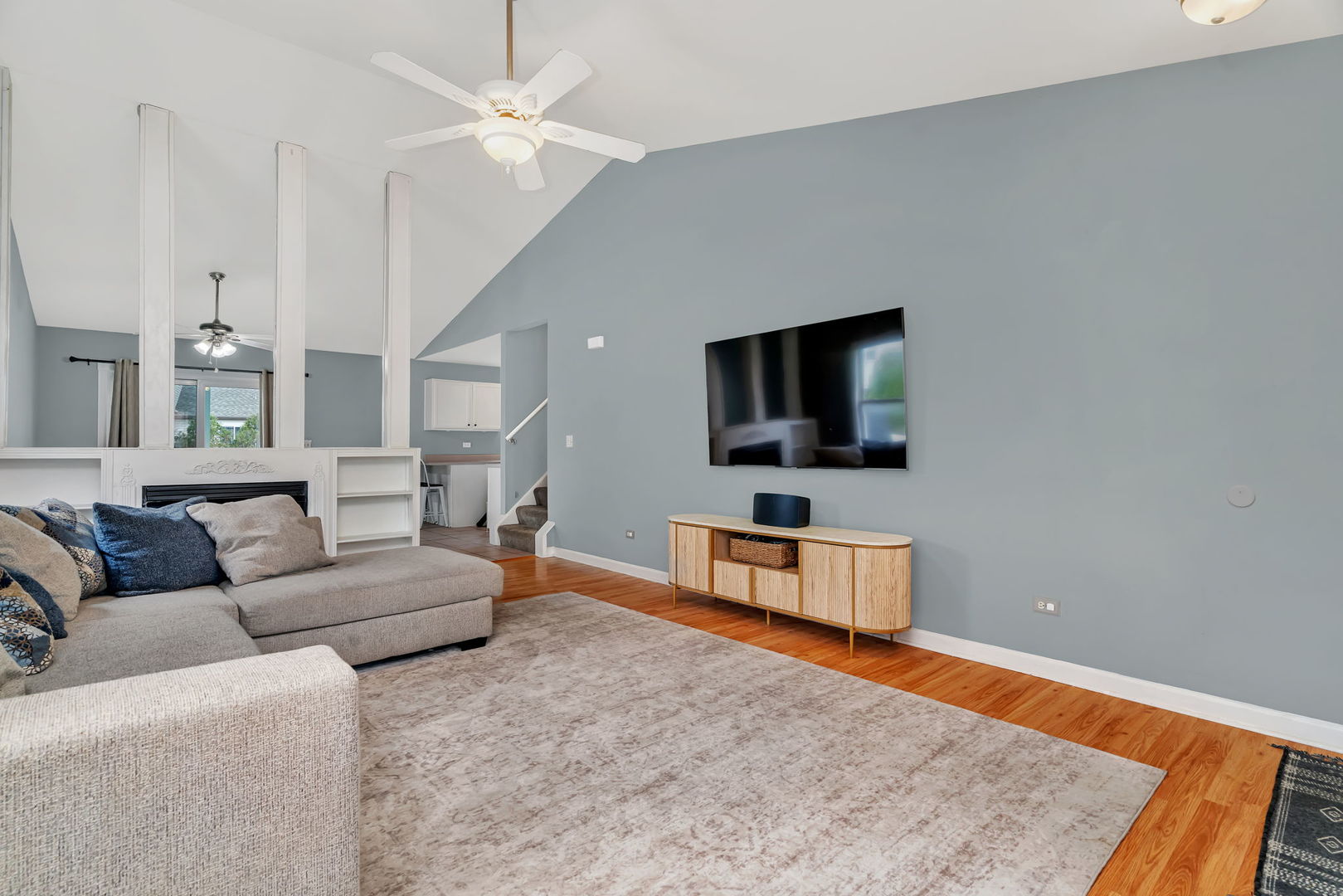 1605 Heritage Pointe Court Plainfield, IL 60586 - Photo 5 of 21 a living room with furniture and a flat screen tv